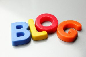 Featured Image. The word BLOG spelled out with colorful letters. 